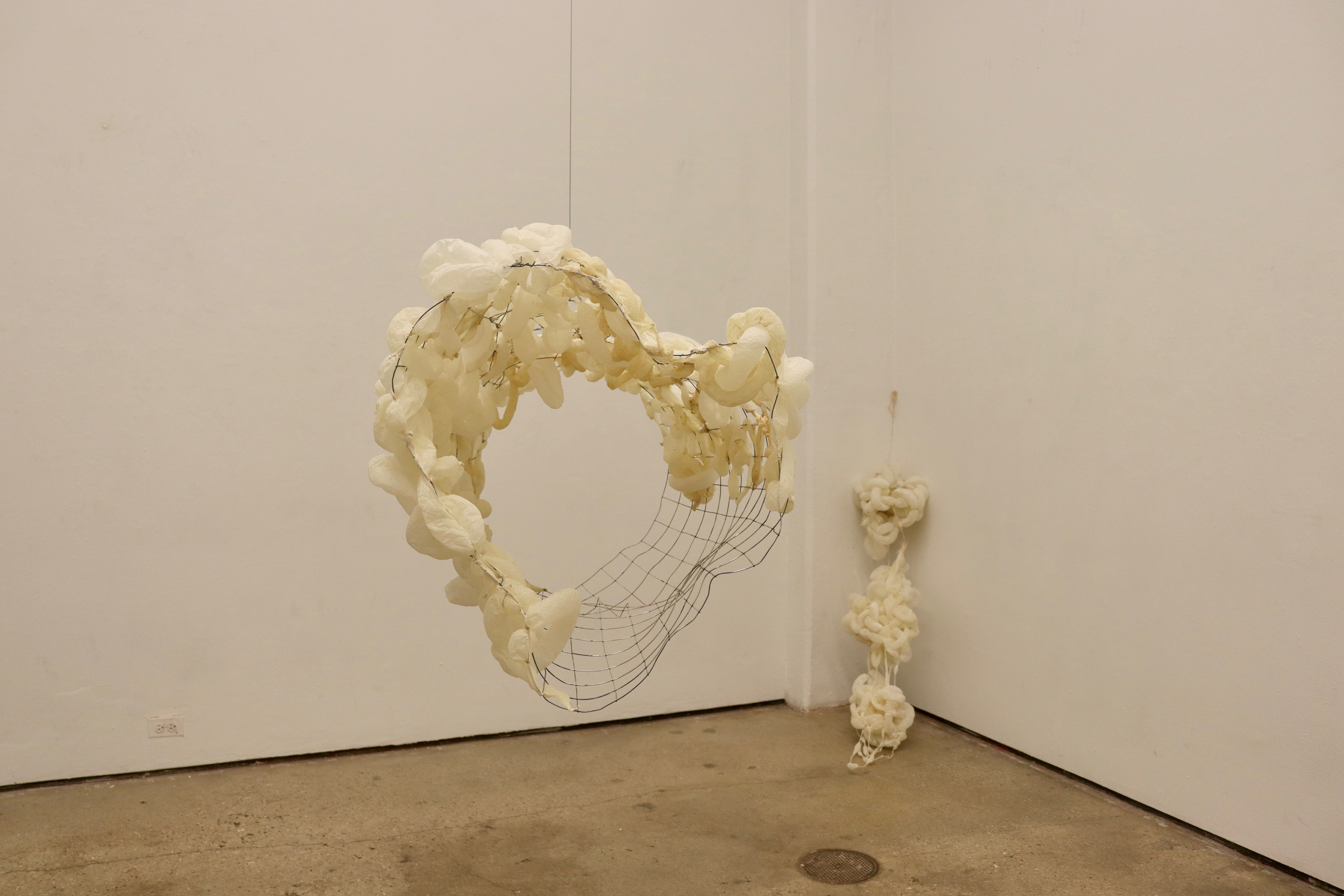 Held at the Edge sculpture by oneg - material transformation and entanglement
