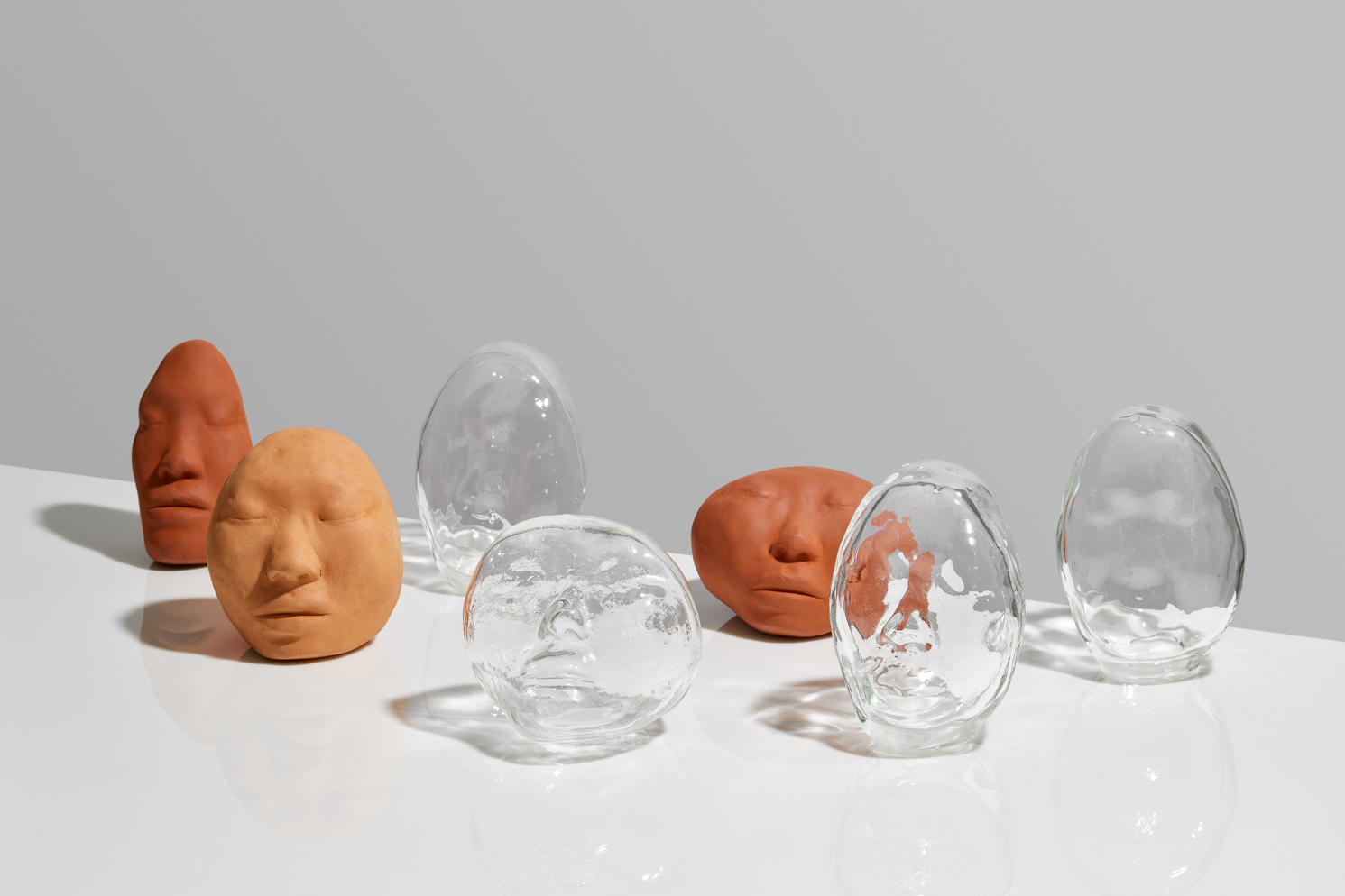 Self-portrait sculpture by oneg - clay and glass work inspired by Korean Jangseung totemic figures