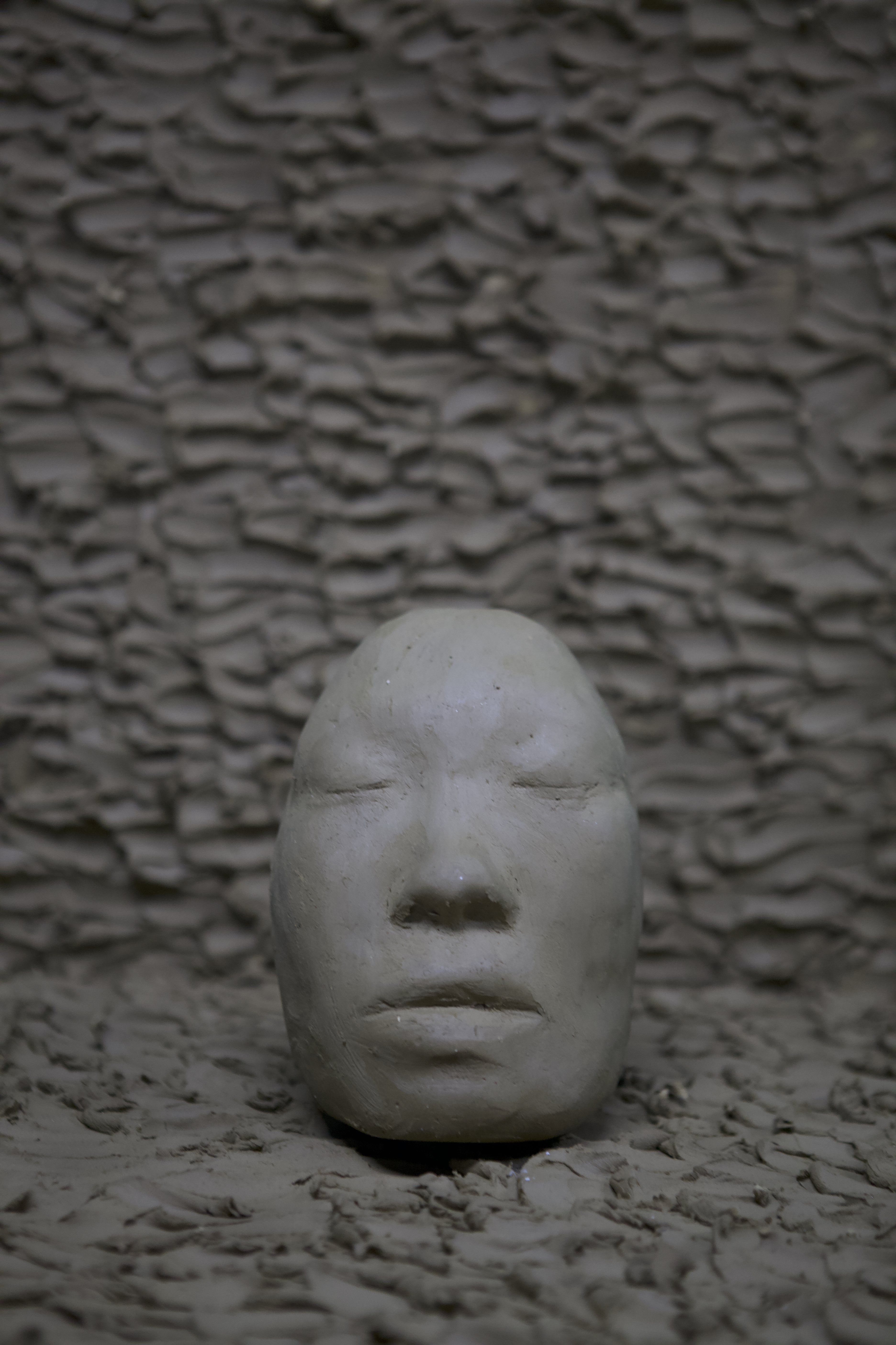 Self-portrait sculpture by oneg - clay and glass work inspired by Korean Jangseung totemic figures