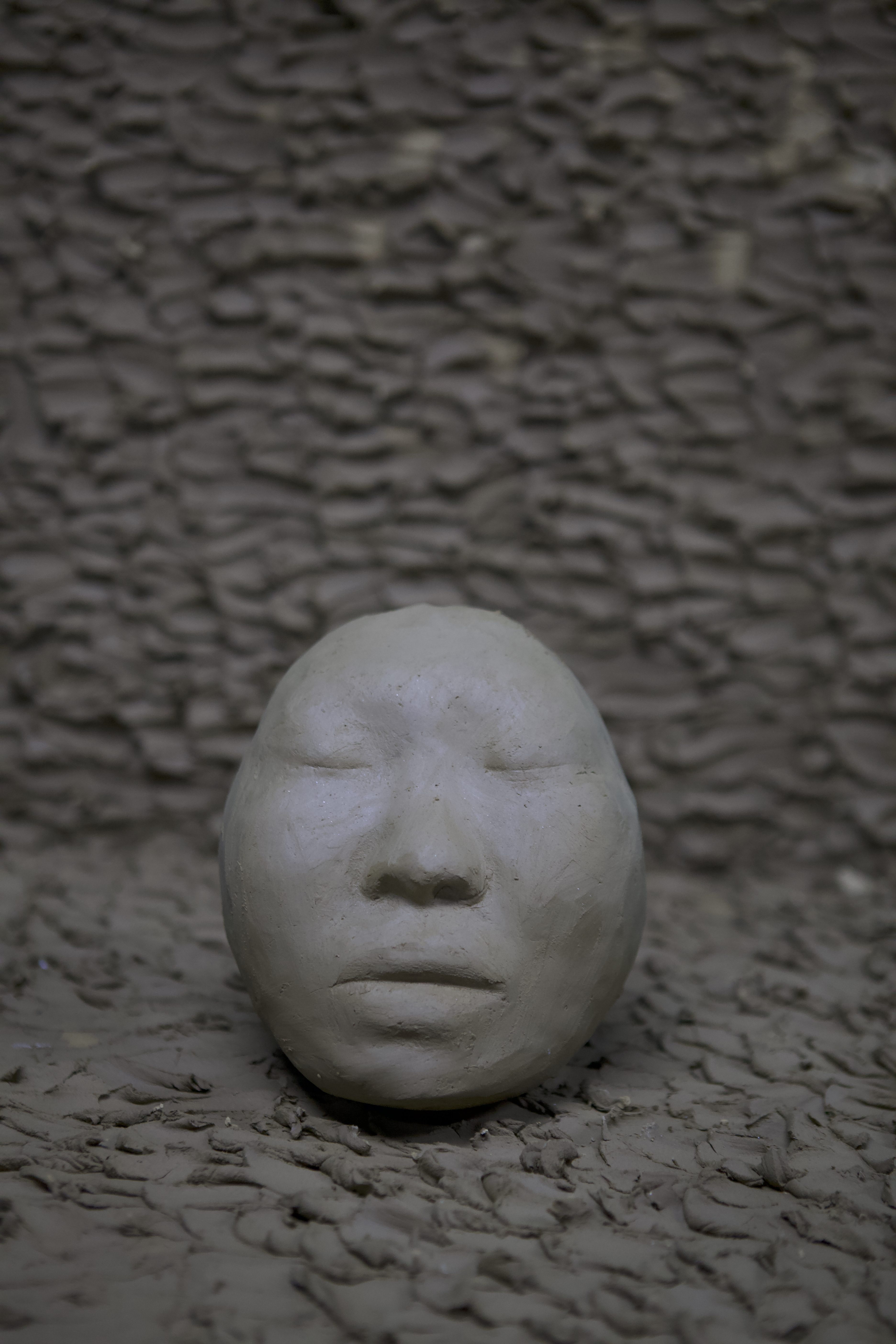 Self-portrait sculpture by oneg - clay and glass work inspired by Korean Jangseung totemic figures