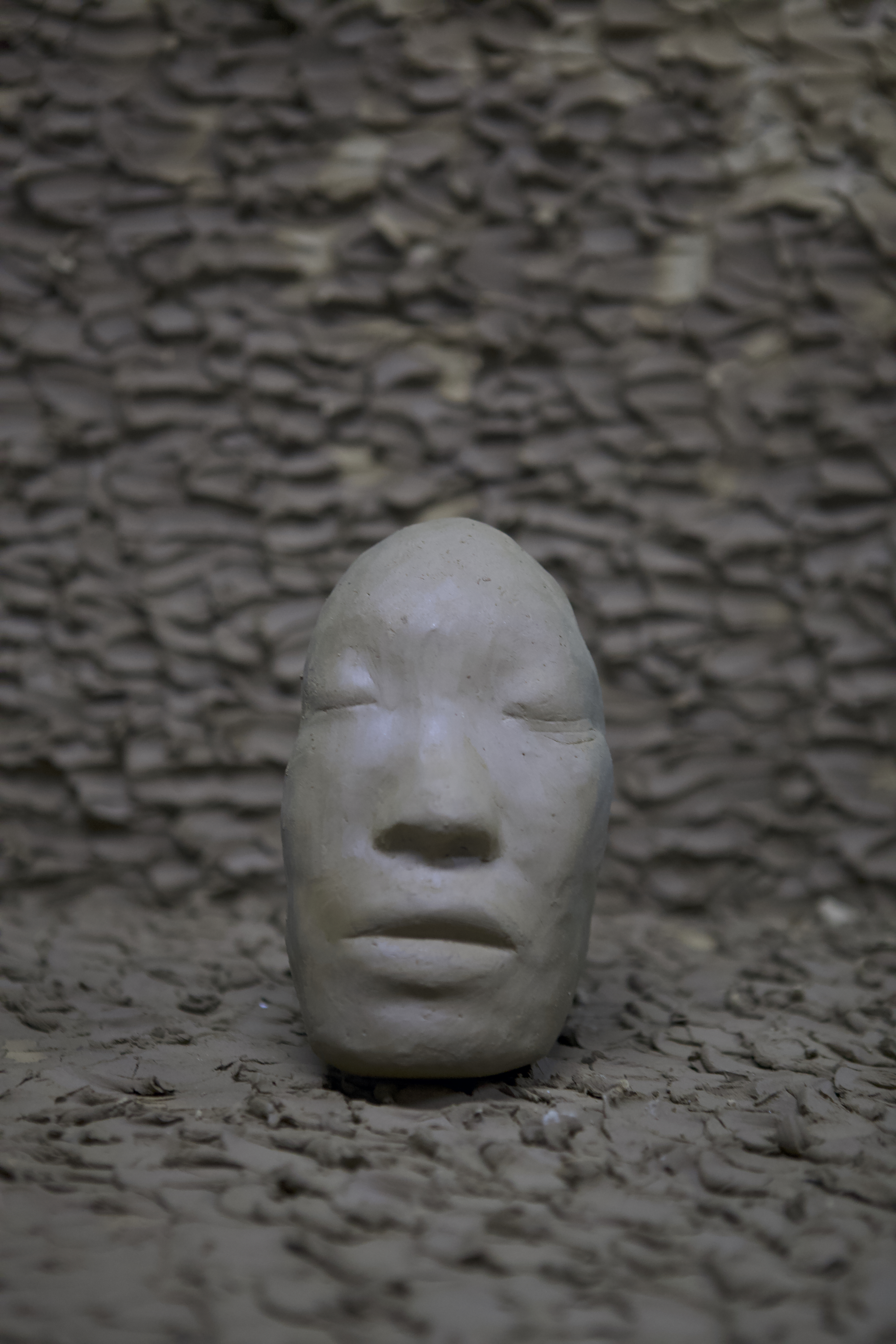 Self-portrait sculpture by oneg - clay and glass work inspired by Korean Jangseung totemic figures