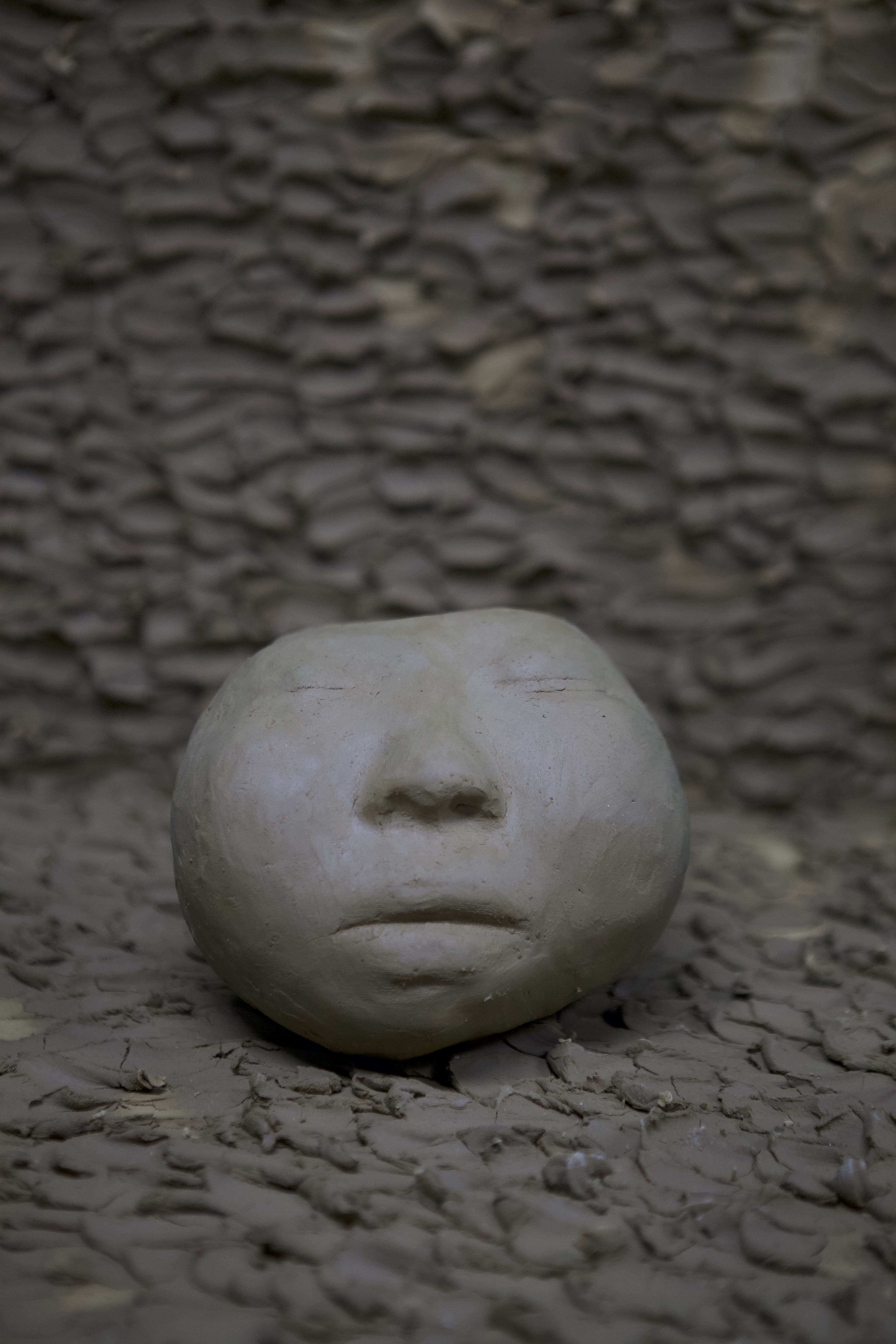 Self-portrait sculpture by oneg - clay and glass work inspired by Korean Jangseung totemic figures