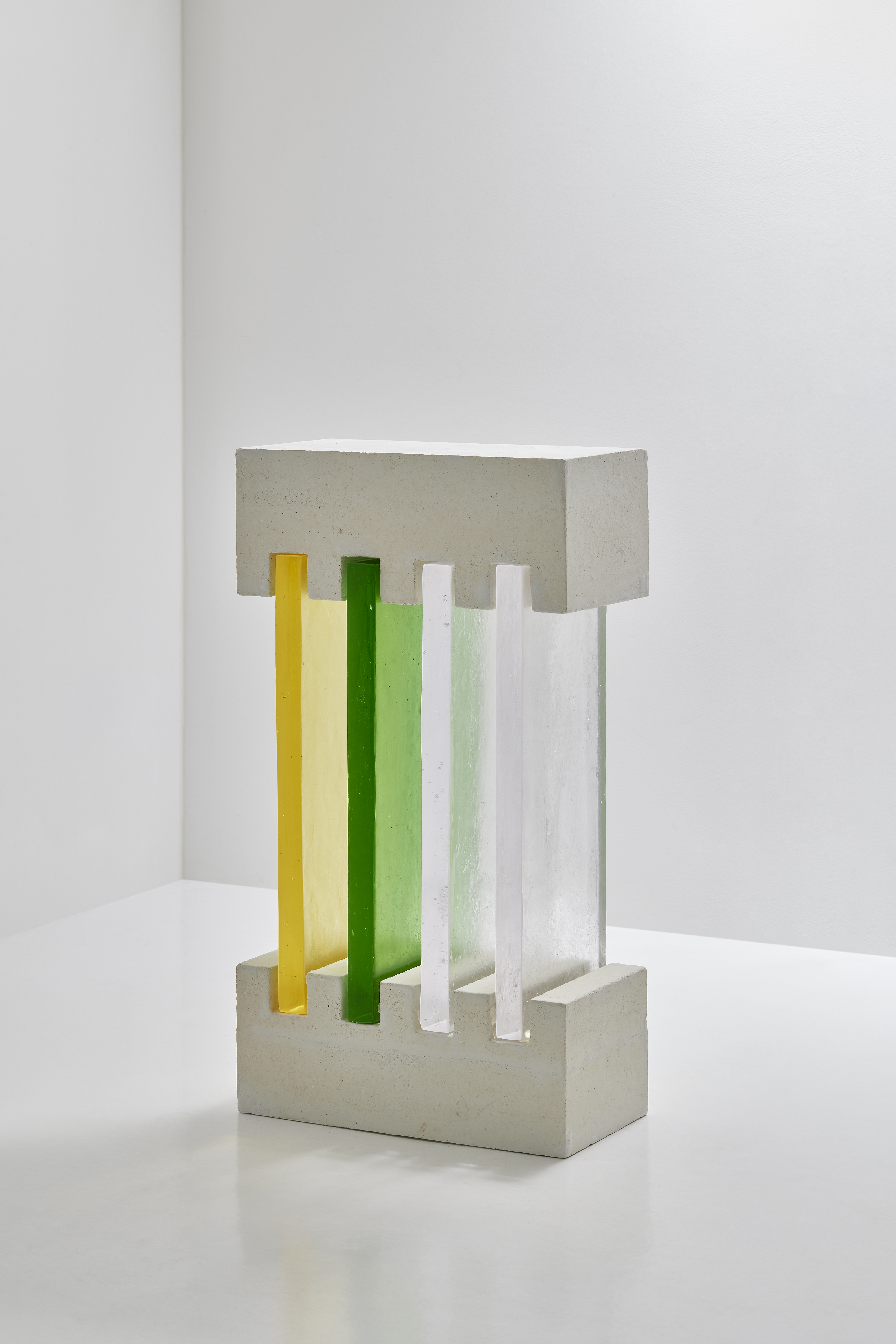 Untitled sculpture by oneg - cement and glass work exploring symmetry and body abstraction